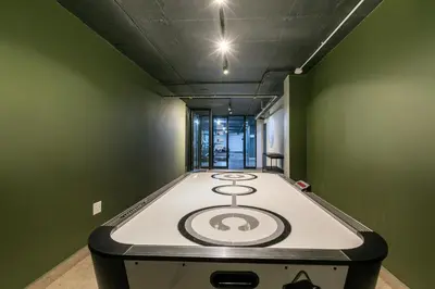 a stove top in a room with green walls at Stylish Stunner in Circa 205 in Pretoria