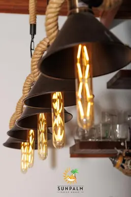 a black chandelier with lights hanging from it at Sunpalm Guesthouse in Nelspruit