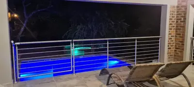a view of a balcony with a blue light through a window at Ikigai4617 Villa in Marloth Park