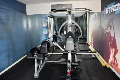 a fitness room with a gym with tread machines at Elcaro Luxury Villas - Urban Taupe 1 in Midrand