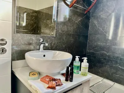 a bathroom with a sink and a mirror at Cozy Retreat in Carlswald 229 in Midrand