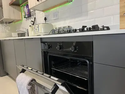 a black oven in a kitchen with a counter at Cozy Retreat in Carlswald 229 in Midrand