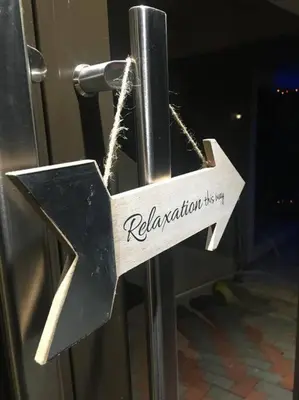 a sign on a metal pole with a star at TG Villa Menlyn in Pretoria