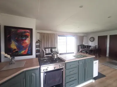 a kitchen with an oven and a stove top oven sidx sidx sidx sidx at Cozy Cabin in Dullstroom