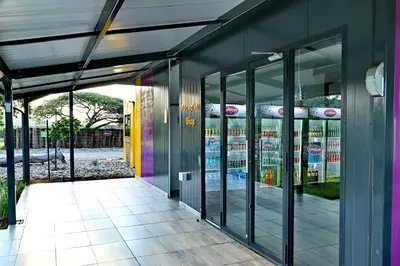 an entrance to a building with glass doors at SleepOver Malelane in Malelane