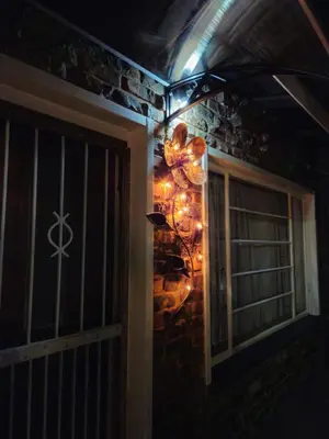a room with a window with lights on the wall at Light House Lodge in Bela-Bela