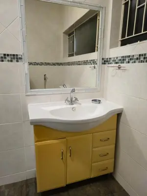 a bathroom with a sink and a mirror at Light House Lodge in Bela-Bela