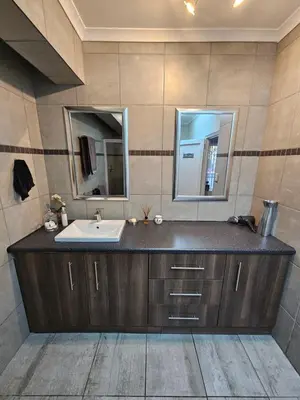 a bathroom with a sink and a mirror at 258 on Aries in Pretoria