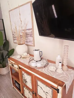 a table with a tea set on top of it at The Blue Shutter Guest House in Haenertsburg