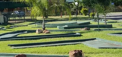 a park with rocks and palm trees on the grass at Bela Bela Pendleberry Grove 52 in Bela-Bela