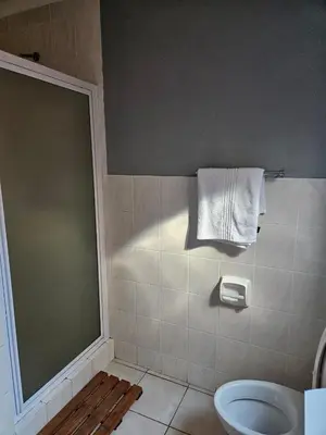 a bathroom with a toilet and a towel rack at Bela Bela Pendleberry Grove 52 in Bela-Bela