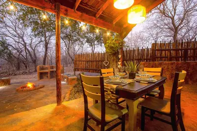 a table and chairs sitting under a gazebo at Wild Whispers in Marloth Park