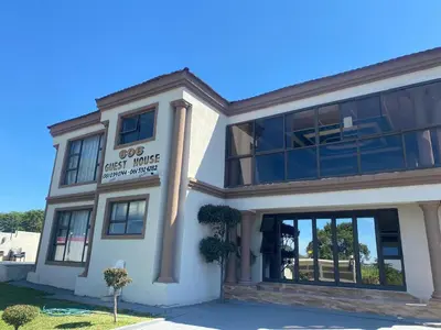 a white building with a guest house at 606 Guesthouse in Bushbuckridge
