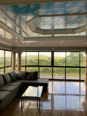 a living room with a couch and a table at 606 Guesthouse in Bushbuckridge