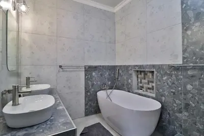 a bathroom with two sinks and a bath tub and a sink at Kruger Stories at Marloth in Marloth Park