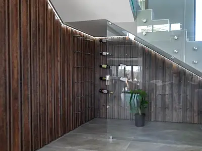 a wooden wall with wine bottles and a plant at The Views at 492 Euphoria Golf Estate in Naboomspruit