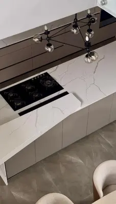 a kitchen with a marble counter top with two chairs at The Views at 492 Euphoria Golf Estate in Naboomspruit