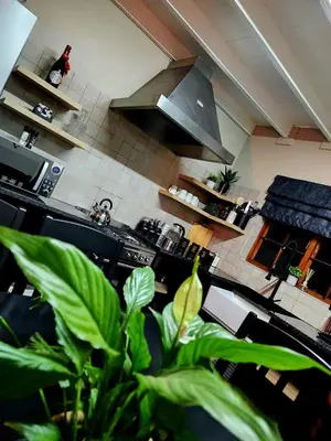 a kitchen with a sink and a stove top oven at Fairstreams Nr3 in Dullstroom