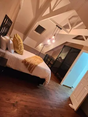 a bedroom with a bed and a large window at Fairstreams Nr3 in Dullstroom