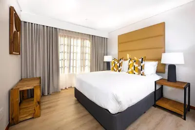 a hotel room with a large bed and a window at ILanga Air B&B in Nelspruit