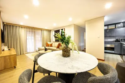 a living room with a table and chairs at ILanga Air B&B in Nelspruit