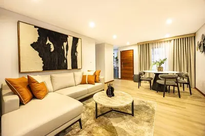 a living room with a couch and a table at ILanga Air B&B in Nelspruit