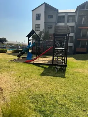 a playground with a slide in a park at Tranquility in Carlswald in Midrand