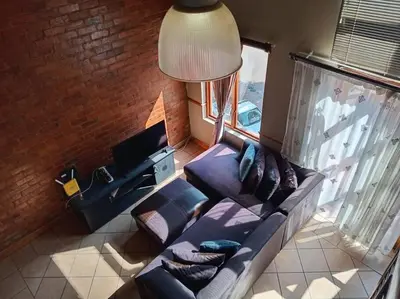 an overhead view of a living room with a couch at Calswald's Skyline Sanctuary in Midrand