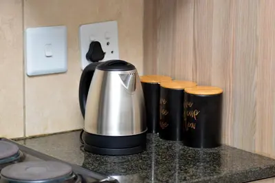 a coffee maker sitting on top of a counter at Home for Us Self catering in Duvhapark