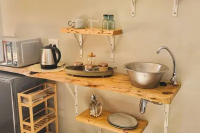 a kitchen counter with a sink and a mixer at Nel's Studio in Benoni