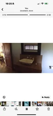 a bathroom with a sink and a mirror at Joes Country lodge in White River