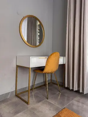 a desk with a chair and a mirror at AndriMat Villa Harties in Hartbeespoort