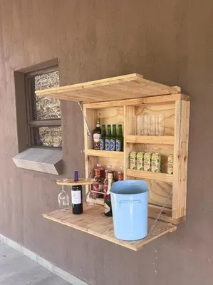 a wooden shelf with bottles and a bucket on a wall at Vivo Per Lei - Marloth Park in Marloth Park