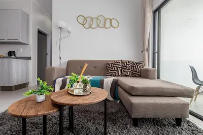 a living room with a couch and a table at Fredas Place 92 On New in Midrand