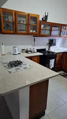 a kitchen with a counter and a stove top oven at The Big Tree selfcatering accommodation in White River