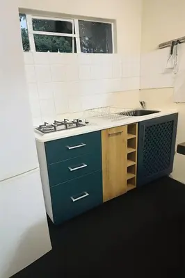 a kitchen with a stove and a sink in it at Panaroma View in Graskop