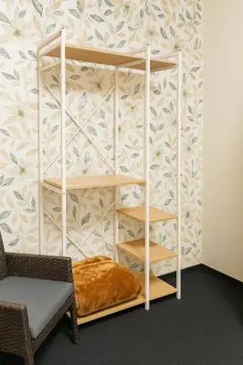 a room with a book shelf against a wall at Panaroma View in Graskop