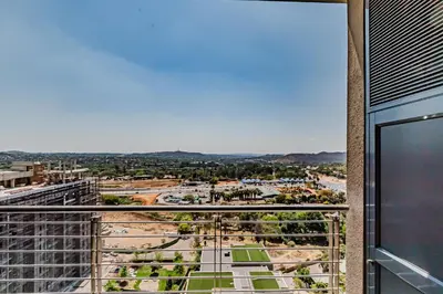 a view of a city from the balcony of a building at 1403 Menlyn Maine Trilogy in Pretoria