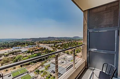 a balcony with a view of a city at 1403 Menlyn Maine Trilogy in Pretoria