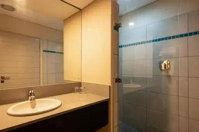 a bathroom with a sink and a mirror at aha Skukuza Safari Lodge in Skukuza