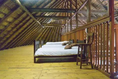 a bedroom with a bed in a yurt at Zebula Lodge 132 in Mabula