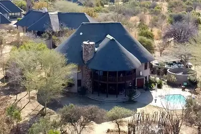 an aerial view of a house with a pool at Zebula Lodge 132 in Mabula
