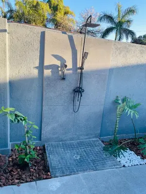 a shower in the side of a wall at Tranquil Unit in Phalaborwa