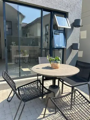 a table and two chairs on a patio with a table at Irenes home of nature in Nelspruit
