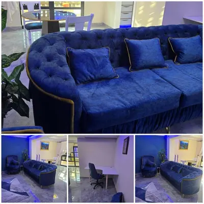 a blue couch with blue pillows in a living room at Best Property Projects in Modimolle
