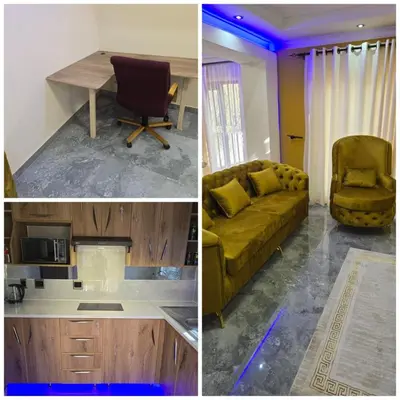 a kitchen and a living room with a couch and a table at Best Property Projects in Modimolle