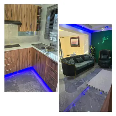 a kitchen with a couch and a kitchen with blue lights at Best Property Projects in Modimolle