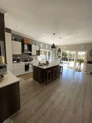 a large kitchen with a large island in the middle at Lovely Family Home in Pecanwood Golf Estate in Kosmos