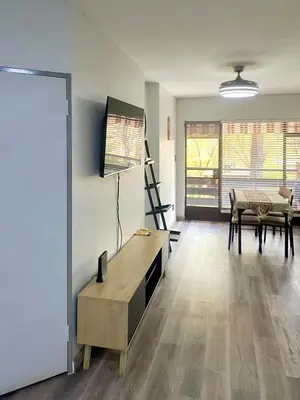 an empty living room with a table and chairs at Entire Apartment in Eldoraigne, Centurion in Eldoraigne
