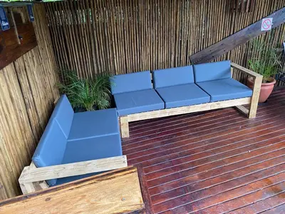 a blue bench sitting on a wooden deck at LA Montranquilo-Home of comfort in Pretoria